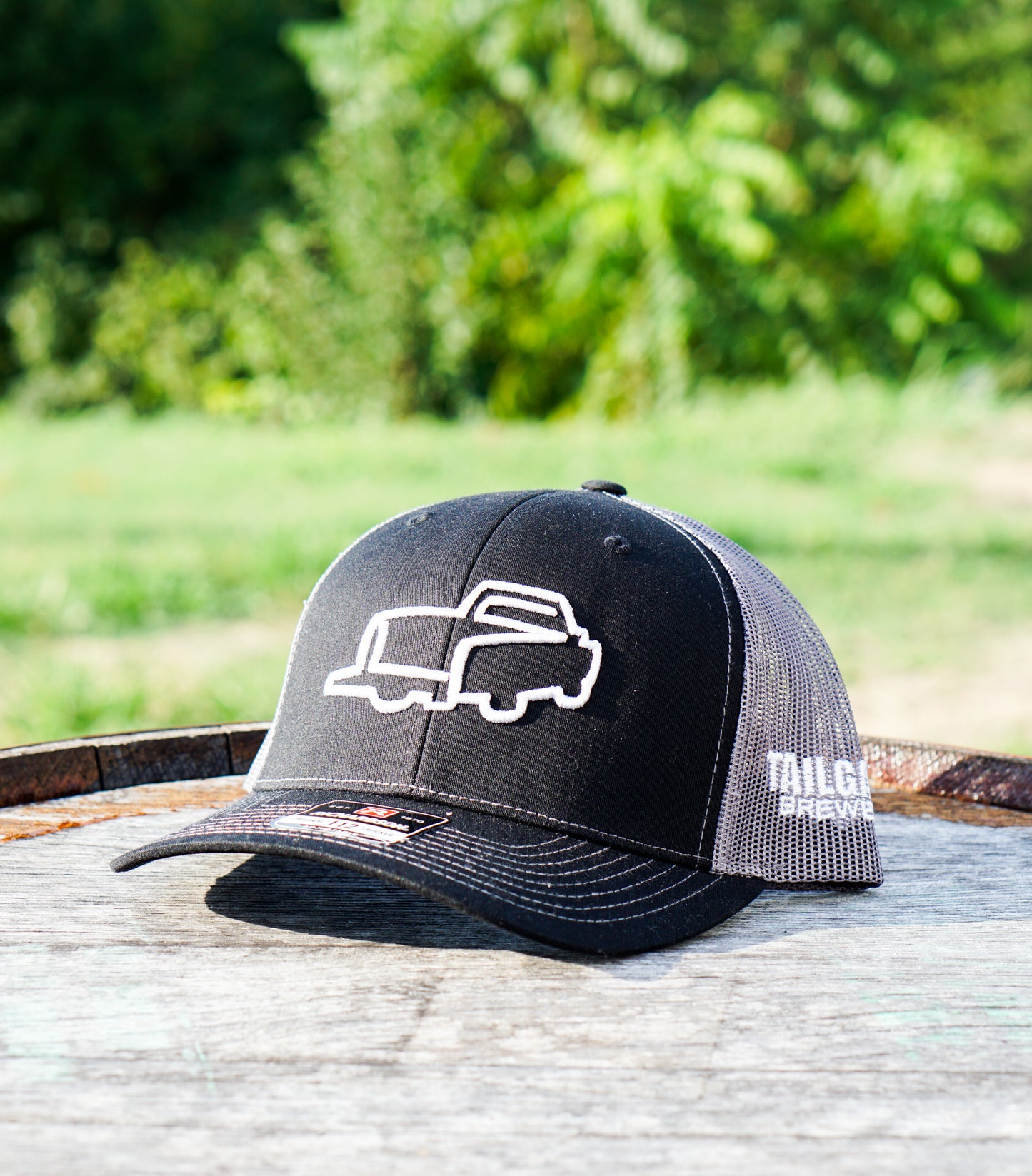 Logo Trucker Hat in Black/Charcoal Mesh